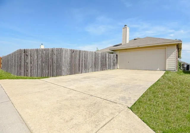 a front view of a house with a garage