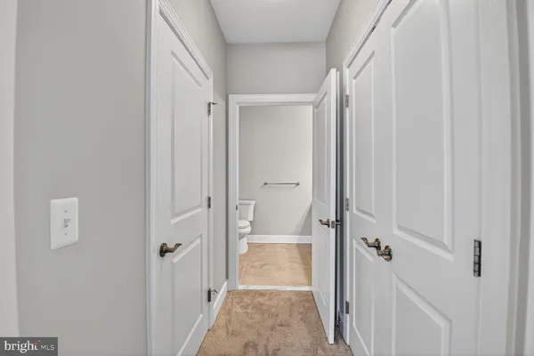 a bathroom with a toilet a sink and shower