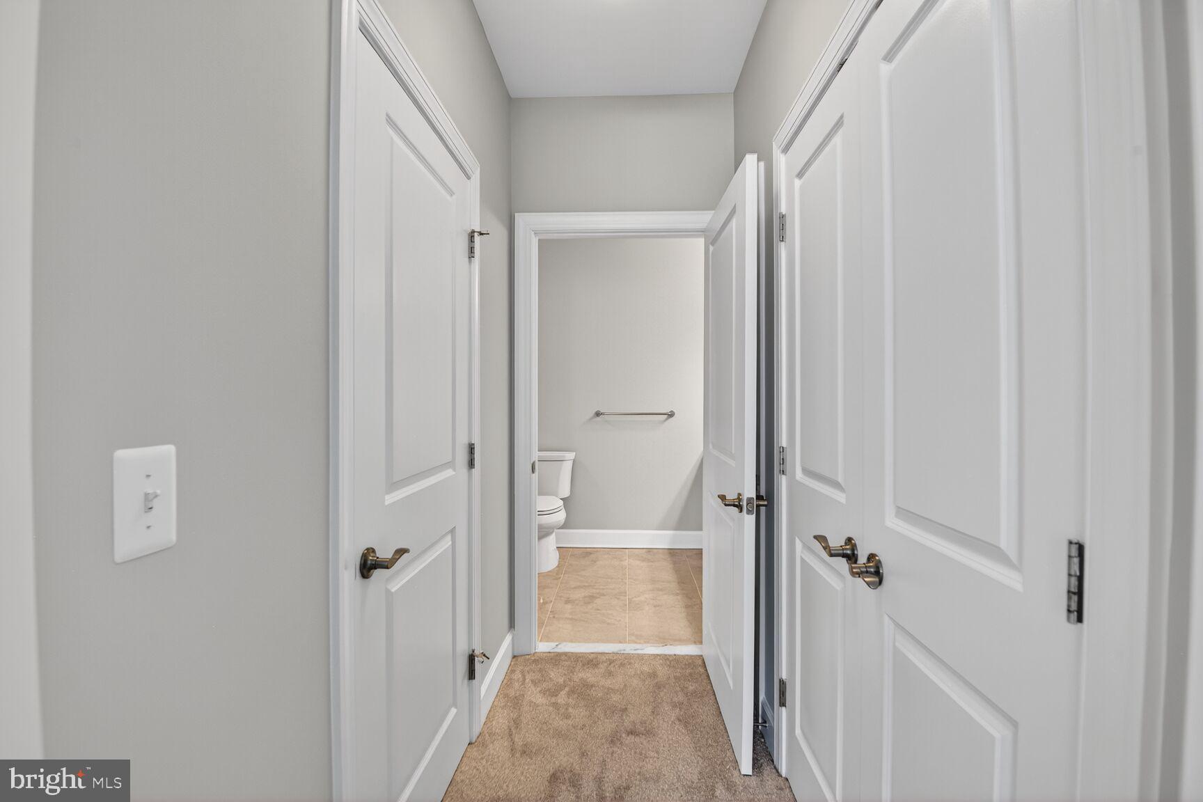10530 Resort Road, Unit 210 Ellicott City, MD 21042 - Photo 15 of 35 a view of a bathroom from a hallway
