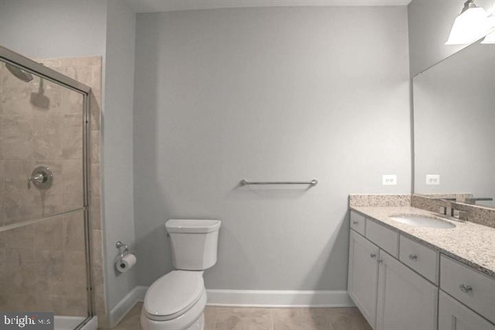 10530 Resort Road, Unit 210 Ellicott City, MD 21042 - Photo 16 of 35 a bathroom with a toilet a sink and shower