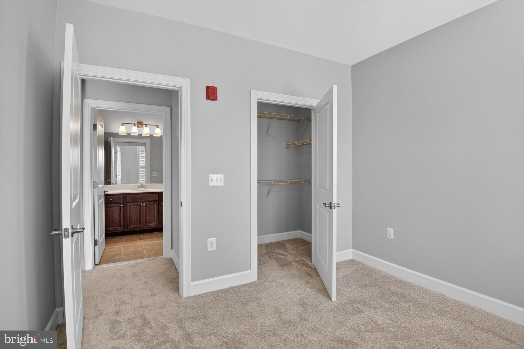 10530 Resort Road, Unit 210 Ellicott City, MD 21042 - Photo 21 of 35 wooden floor and view of an empty room