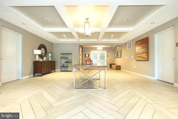 a view of an entryway with a chandelier