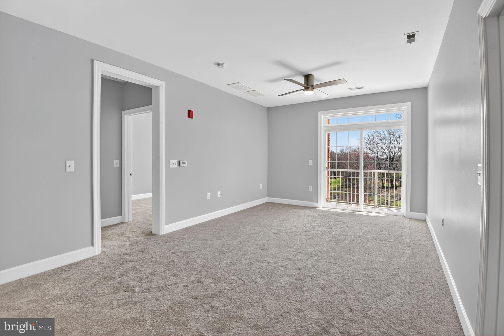10530 Resort Road, Unit 210 Ellicott City, MD 21042 - Photo 8 of 35 a view of an empty room with a window