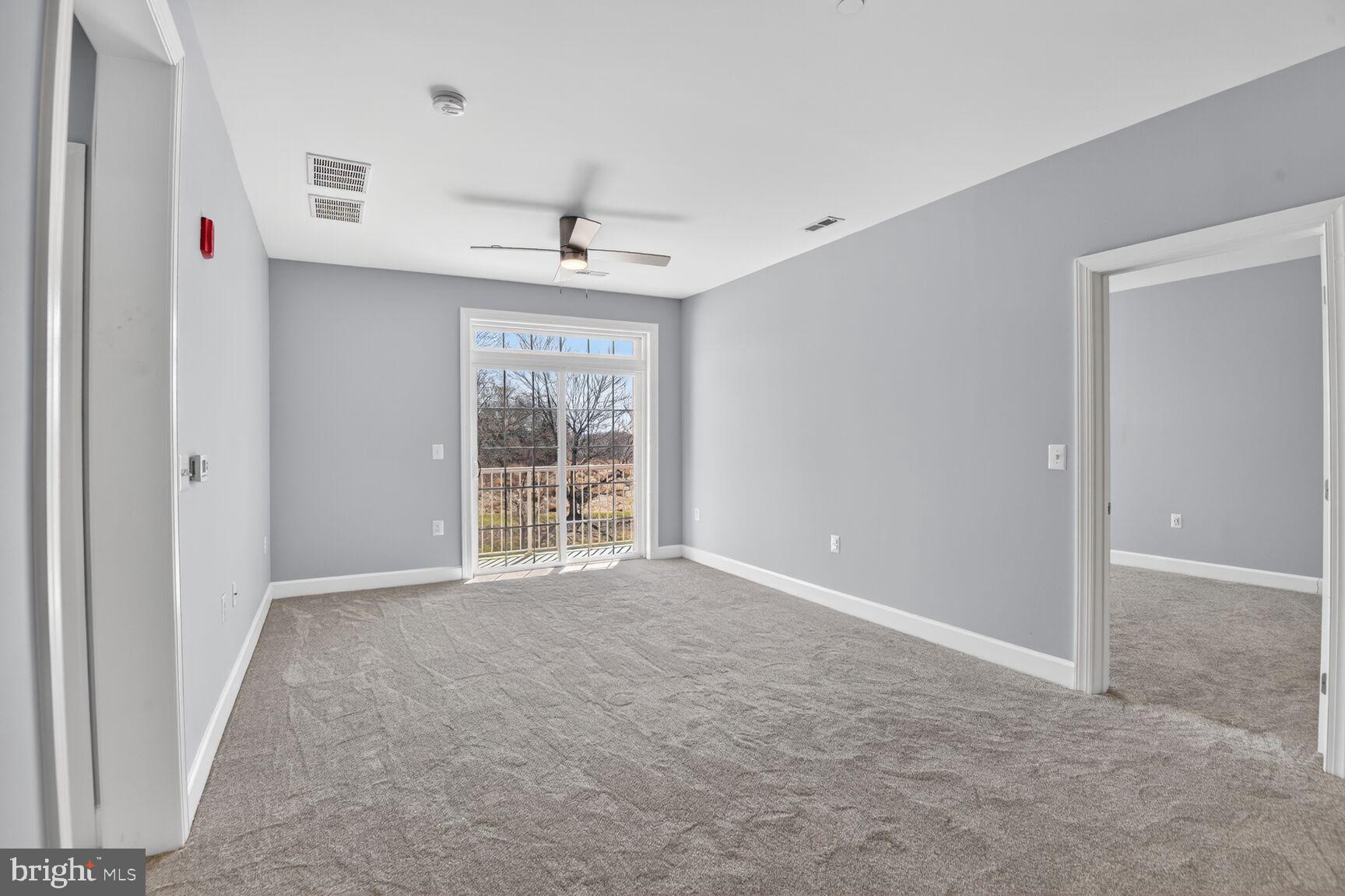 10530 Resort Road, Unit 210 Ellicott City, MD 21042 - Photo 10 of 35 a view of an empty room with a window