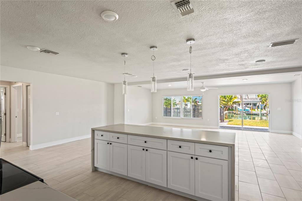 516 Crystal Drive Madeira Beach, FL 33708 - Photo 11 of 25 a kitchen with a sink and cabinets
