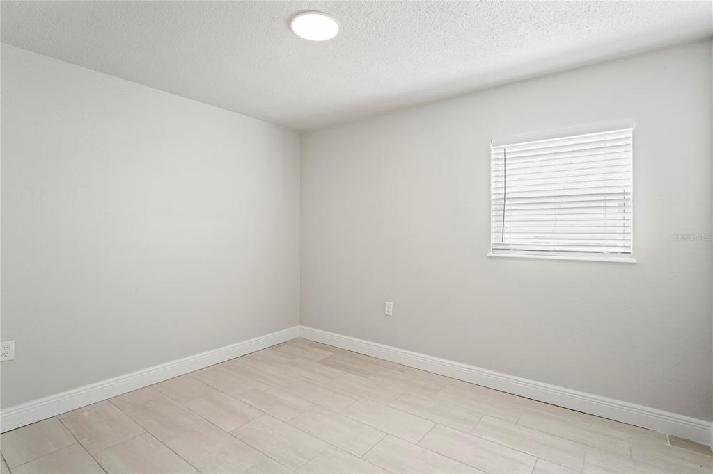 516 Crystal Drive Madeira Beach, FL 33708 - Photo 18 of 25 an empty room with a window