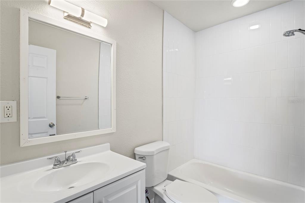 516 Crystal Drive Madeira Beach, FL 33708 - Photo 20 of 25 a bathroom with a sink toilet and vanity