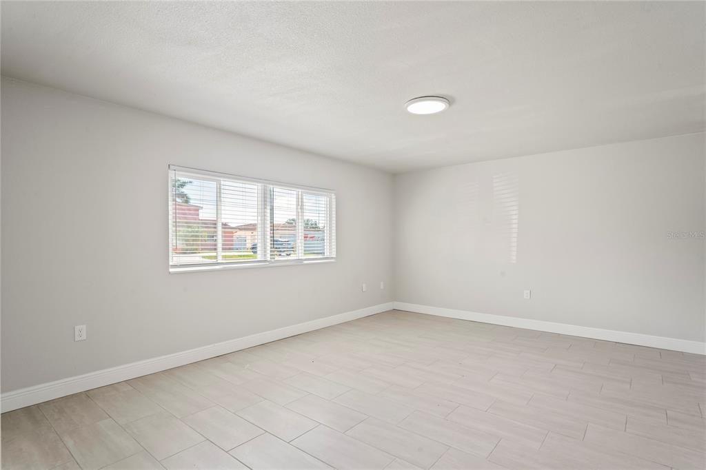 516 Crystal Drive Madeira Beach, FL 33708 - Photo 21 of 25 an empty room with a window