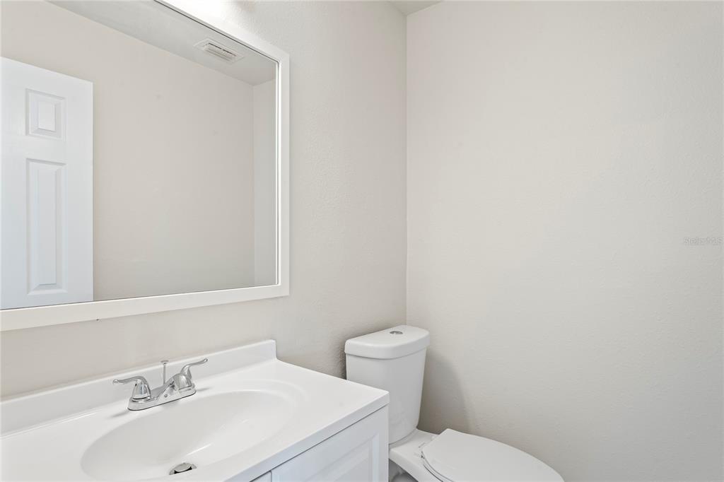 516 Crystal Drive Madeira Beach, FL 33708 - Photo 23 of 25 a bathroom with a sink and a toilet