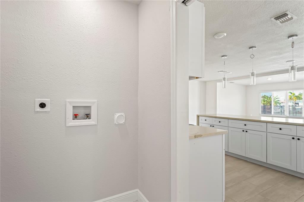516 Crystal Drive Madeira Beach, FL 33708 - Photo 24 of 25 a view of a kitchen with white cabinets