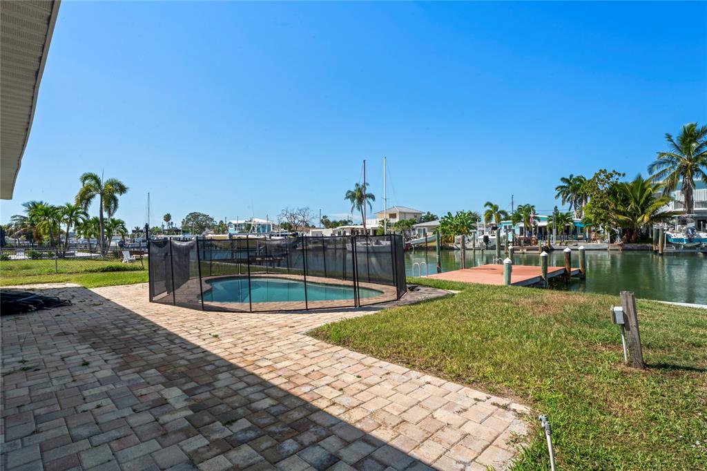 516 Crystal Drive Madeira Beach, FL 33708 - Photo 3 of 25 a view of a swimming pool with a lake view