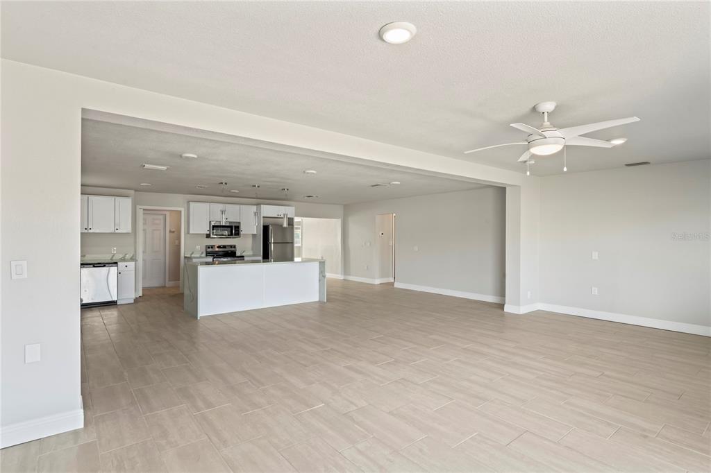 516 Crystal Drive Madeira Beach, FL 33708 - Photo 8 of 25 a view of an empty room with a kitchen