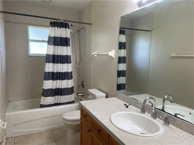 a bathroom with a sink a vanity and a mirror