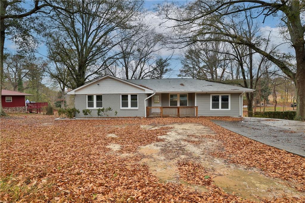 4865 Butner Road College Park, GA 30349 - Photo 1 of 1 a front view of a house with a yard and garage