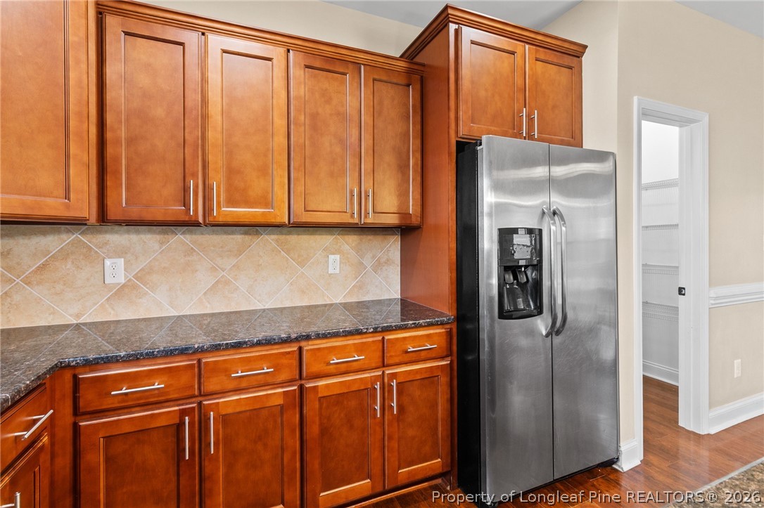 368 Exeter Drive Raeford, NC 28376 - Photo 14 of 49 a kitchen with stainless steel appliances granite countertop a refrigerator and cabinets