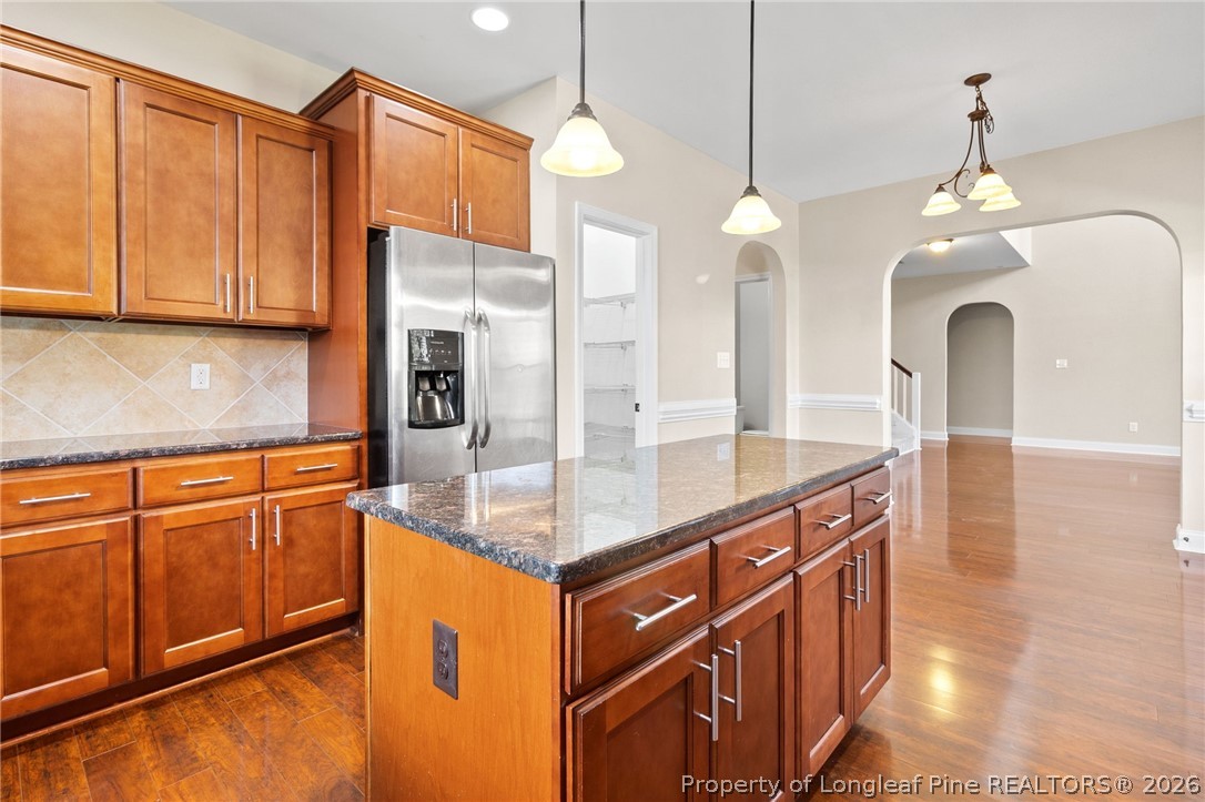 368 Exeter Drive Raeford, NC 28376 - Photo 15 of 49 a kitchen with stainless steel appliances granite countertop a sink a stove and a refrigerator