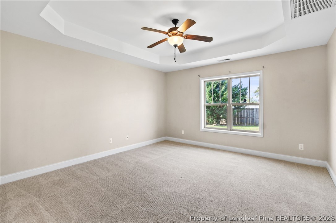 368 Exeter Drive Raeford, NC 28376 - Photo 18 of 49 an empty room with windows and ceiling fan