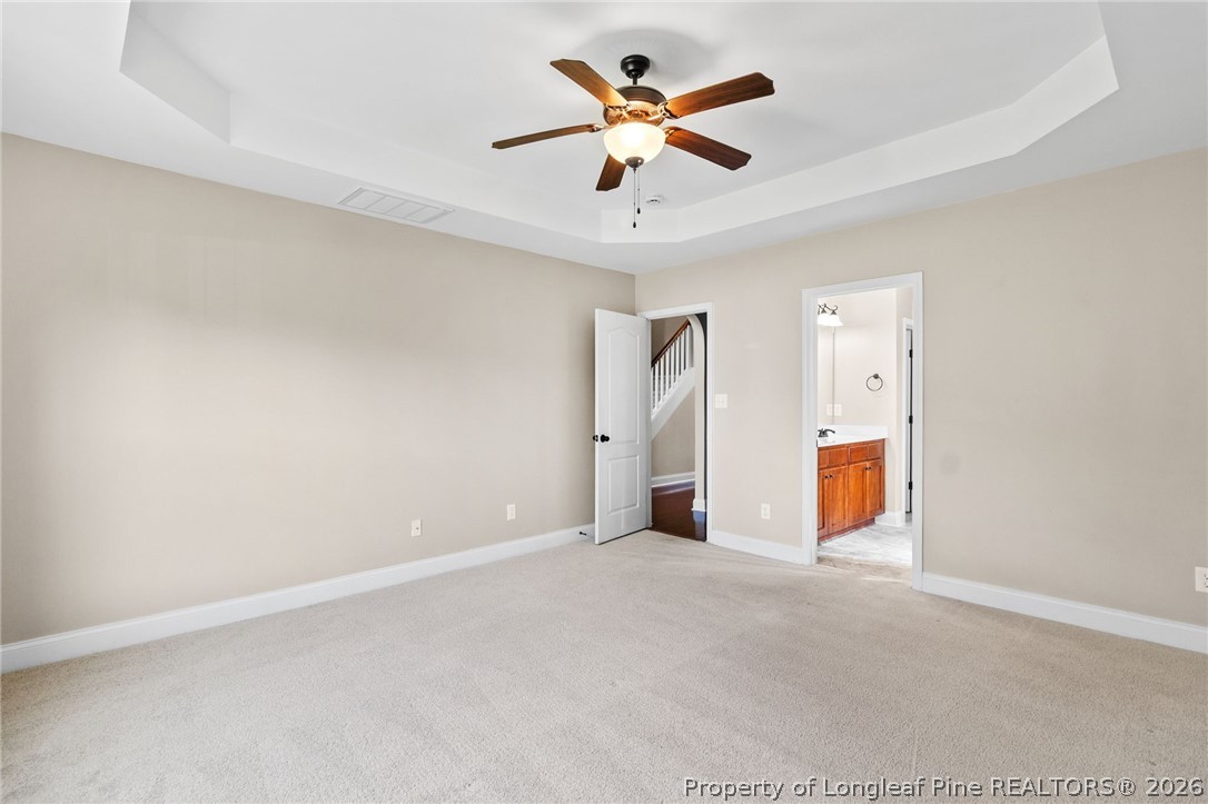 368 Exeter Drive Raeford, NC 28376 - Photo 19 of 49 a view of a livingroom with a ceiling fan a ceiling fan and wooden floor