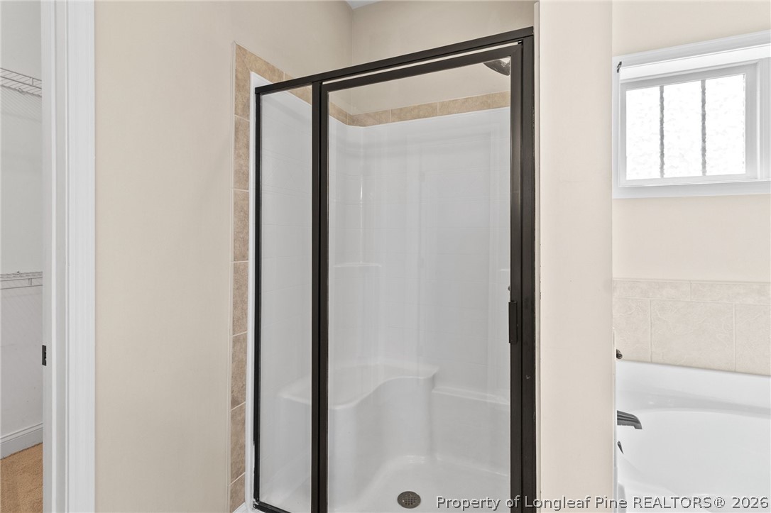 368 Exeter Drive Raeford, NC 28376 - Photo 22 of 49 a bathroom with a glass shower door