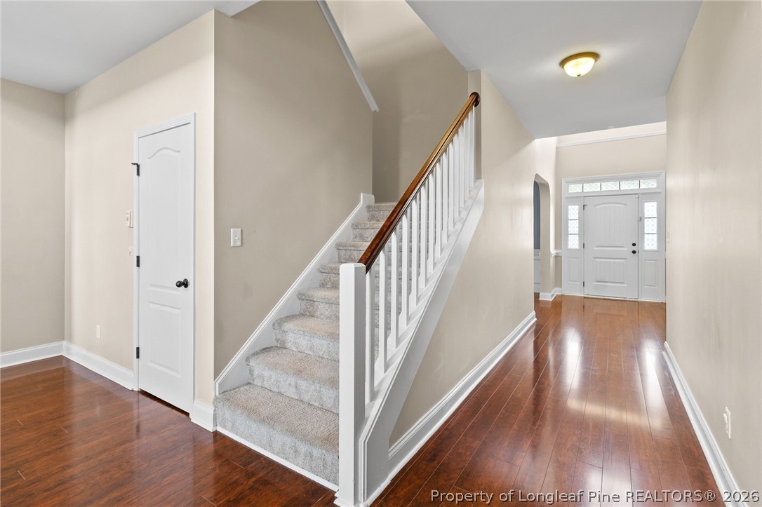 368 Exeter Drive Raeford, NC 28376 - Photo 27 of 49 a view of a hallway with wooden floor and staircase