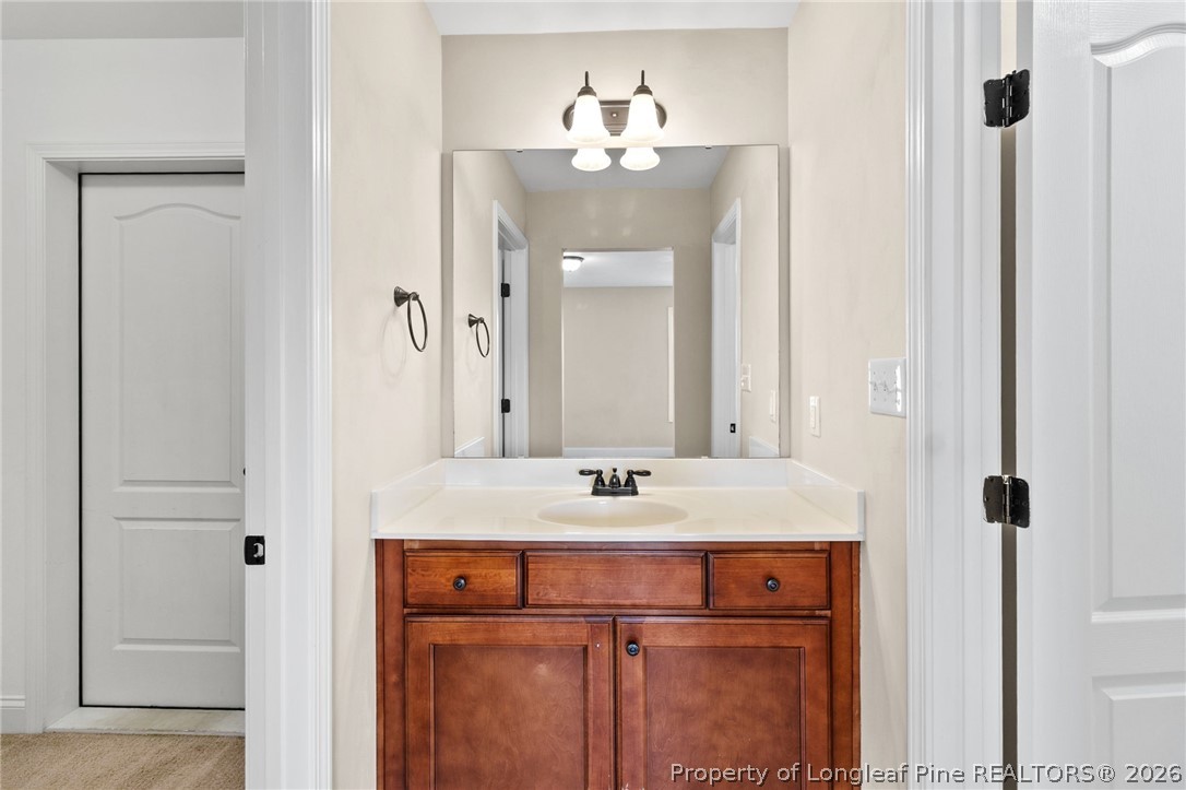 368 Exeter Drive Raeford, NC 28376 - Photo 32 of 49 a bathroom with a sink and a mirror