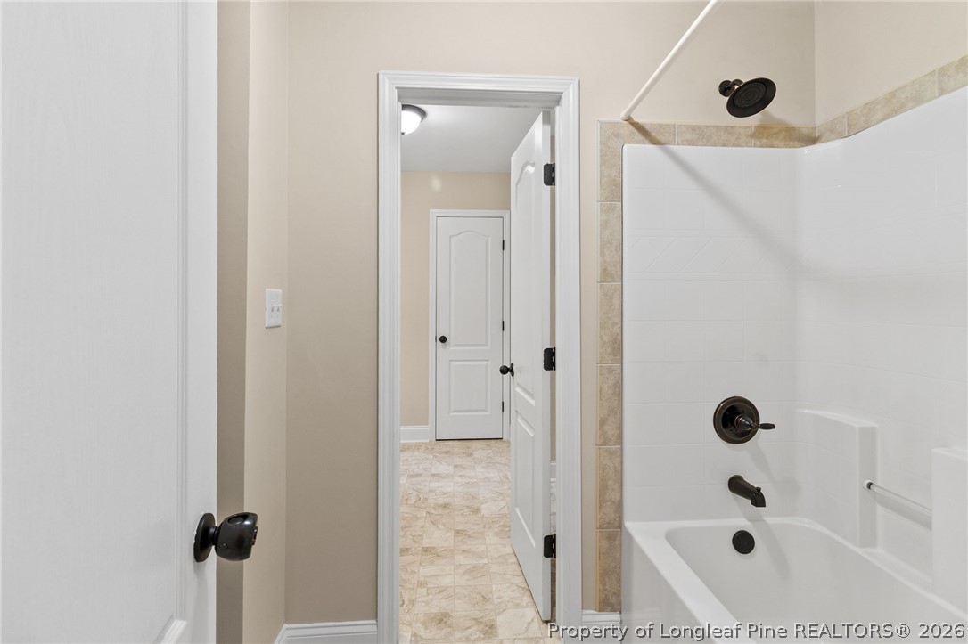 368 Exeter Drive Raeford, NC 28376 - Photo 34 of 49 a bathroom with a tub shower and vanity