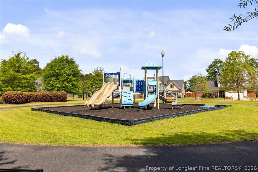 368 Exeter Drive Raeford, NC 28376 - Photo 47 of 49 a view of a swimming pool with an outdoor seating and a yard