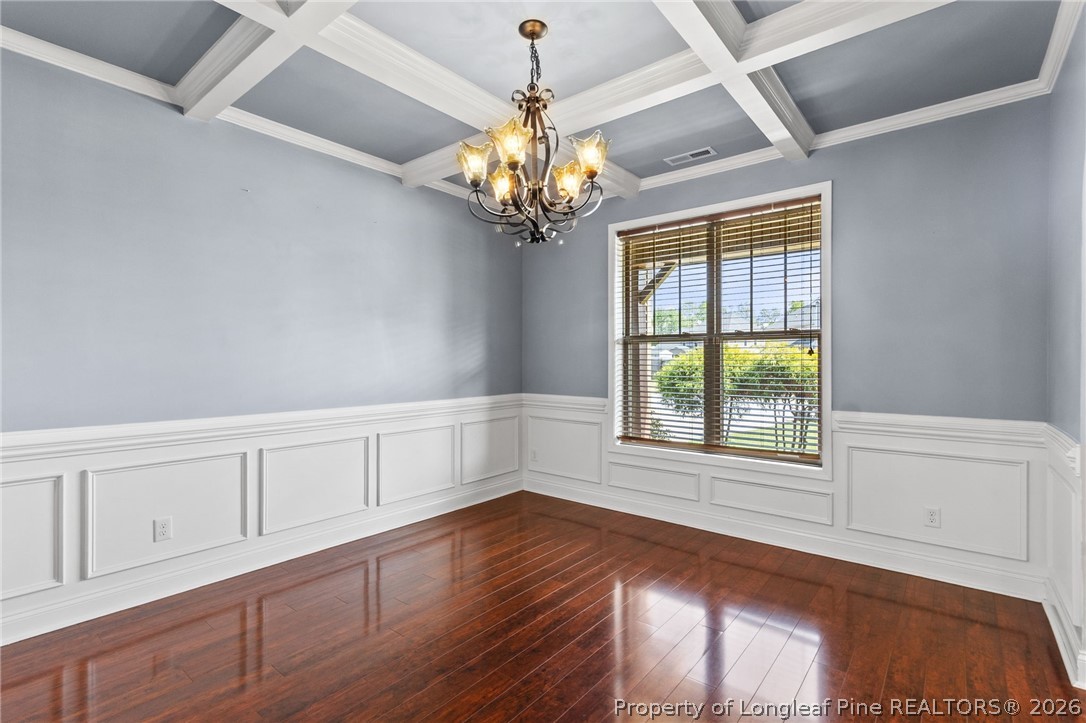 368 Exeter Drive Raeford, NC 28376 - Photo 6 of 49 a view of an empty room with a window and wooden floor