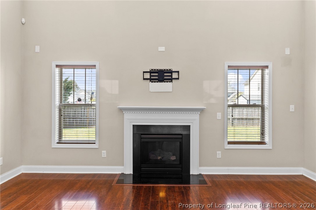 368 Exeter Drive Raeford, NC 28376 - Photo 9 of 49 a living room with wooden floor and a fireplace