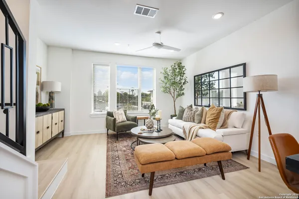 a living room with furniture and a table