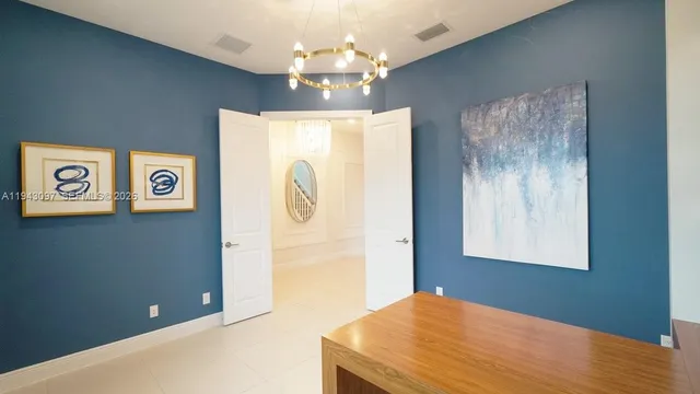 a view of a hallway with a sink and a mirror