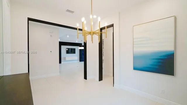 a view of a room with window and a ceiling fan