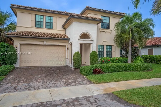 an aerial view of a house with a swimming pool yard and outdoor seating