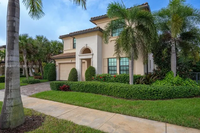 a front view of house with yard and green space
