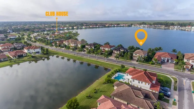 a view of a livingroom with wooden floor and white doors