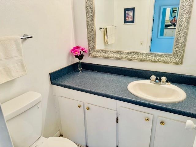 9401 Lime Bay Boulevard, Unit 114 Tamarac, FL 33321 - Photo 11 of 16 a bathroom with a sink and a toilet