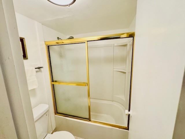 9401 Lime Bay Boulevard, Unit 114 Tamarac, FL 33321 - Photo 6 of 16 a bathroom with a glass shower door