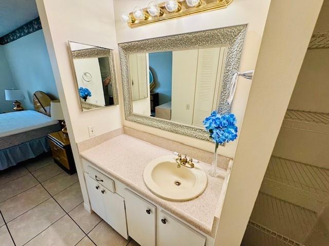 9401 Lime Bay Boulevard, Unit 114 Tamarac, FL 33321 - Photo 8 of 16 a bathroom with a sink and a mirror