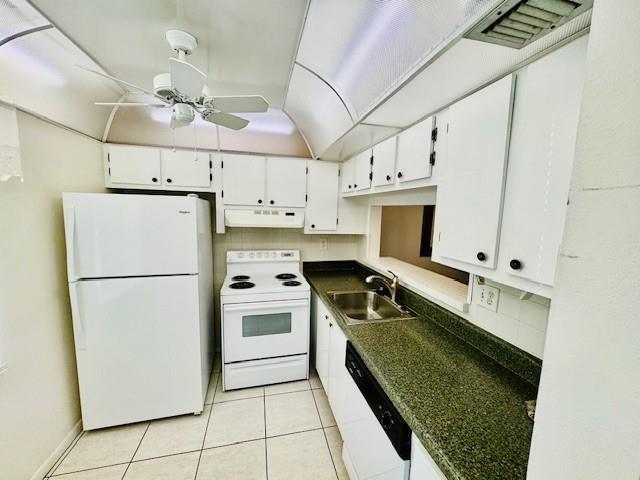 9401 Lime Bay Boulevard, Unit 114 Tamarac, FL 33321 - Photo 10 of 16 a kitchen with kitchen island a counter top space a stainless steel appliances a sink and cabinets