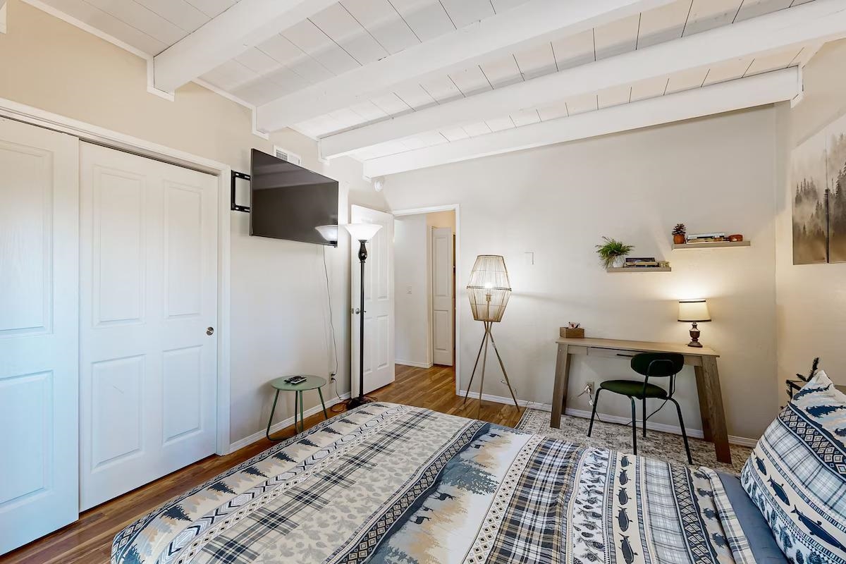19385 Ferretti Road Groveland, CA 95321 - Photo 14 of 47 Bedroom with a closet, a wooden ceiling with exposed beams, and wood finished floors