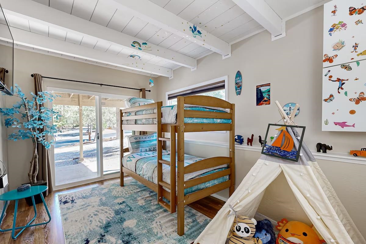 19385 Ferretti Road Groveland, CA 95321 - Photo 15 of 47 Bedroom featuring multiple windows, wood finished floors, a wood ceiling with exposed beams, and access to outside