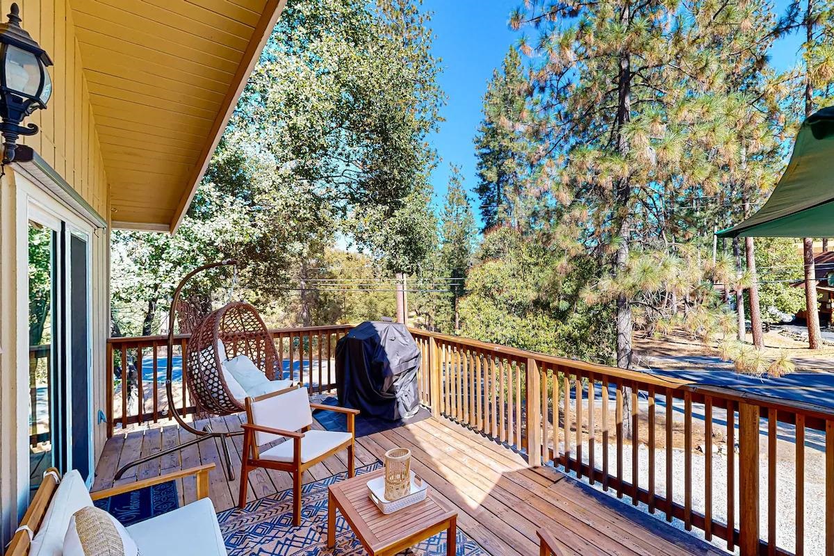 19385 Ferretti Road Groveland, CA 95321 - Photo 3 of 47 Wooden deck featuring area for grilling and view of wooded area