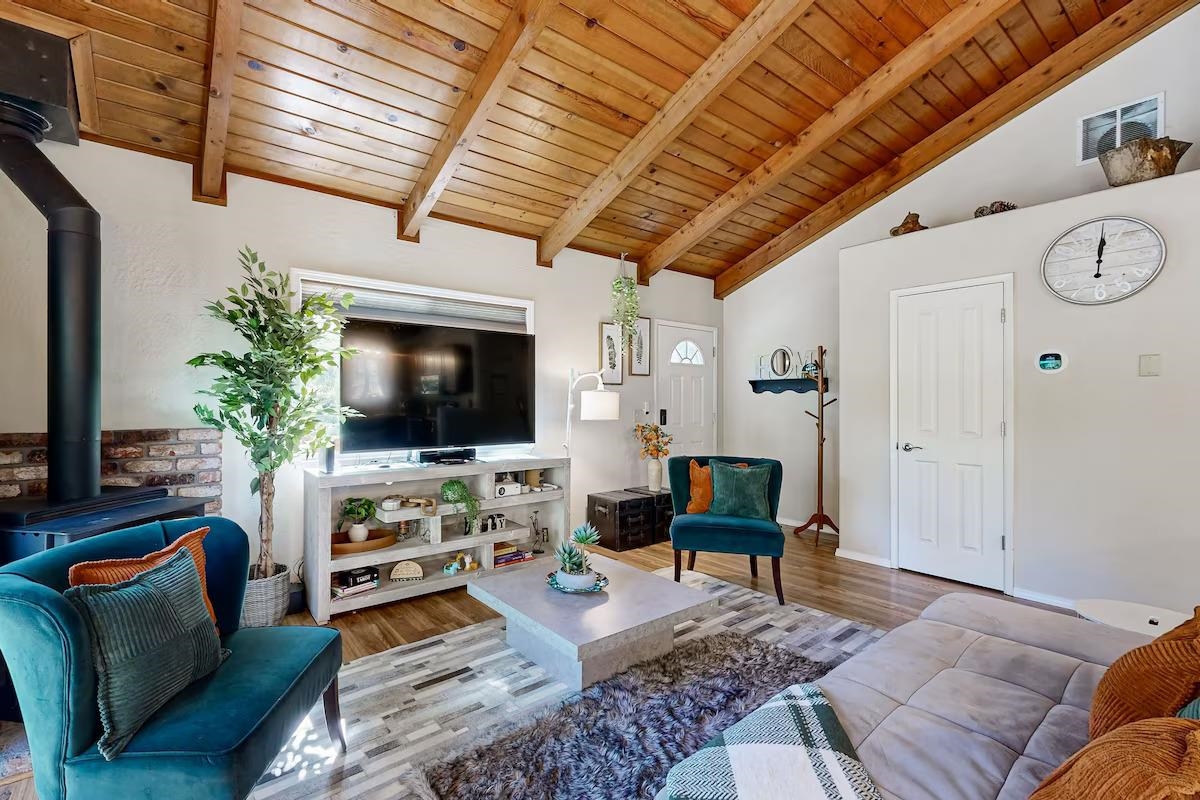 19385 Ferretti Road Groveland, CA 95321 - Photo 5 of 47 Living area with a wood stove, wood ceiling, and wood finished floors