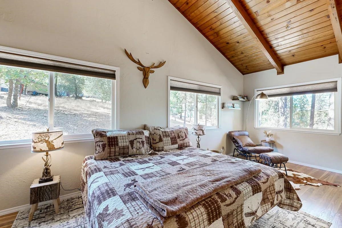 19385 Ferretti Road Groveland, CA 95321 - Photo 10 of 47 Bedroom featuring wood finished floors, multiple windows, a wood ceiling with exposed beams, and high vaulted ceiling