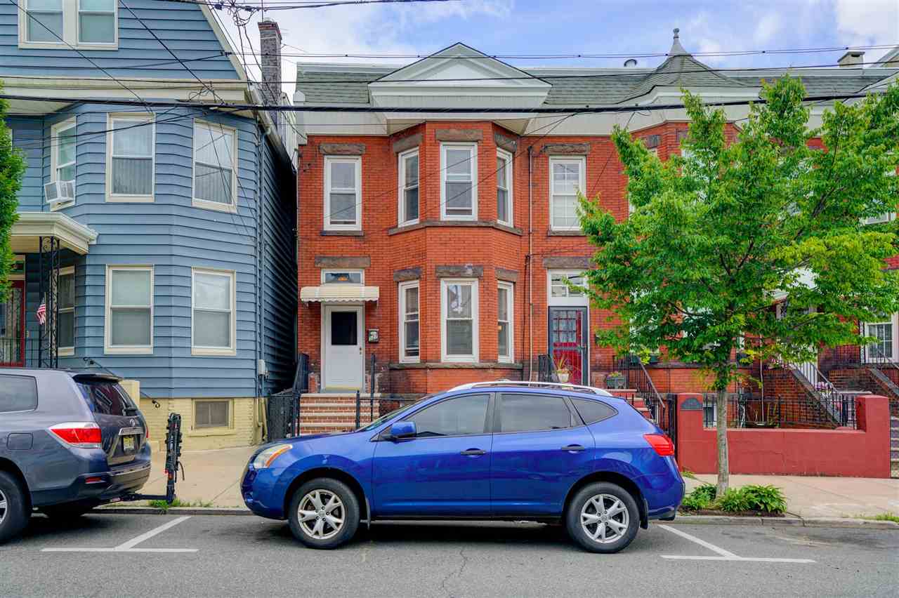 527 North 3rd Street East Newark, NJ 07029 - Photo 2 of 25 a car parked in front of a building