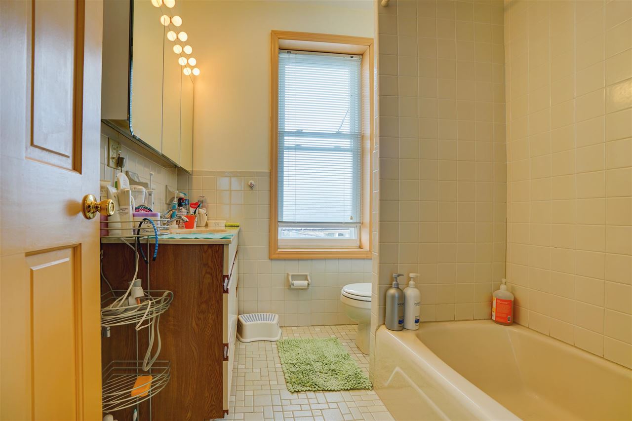 527 North 3rd Street East Newark, NJ 07029 - Photo 12 of 25 a bathroom with a tub a sink and a shower