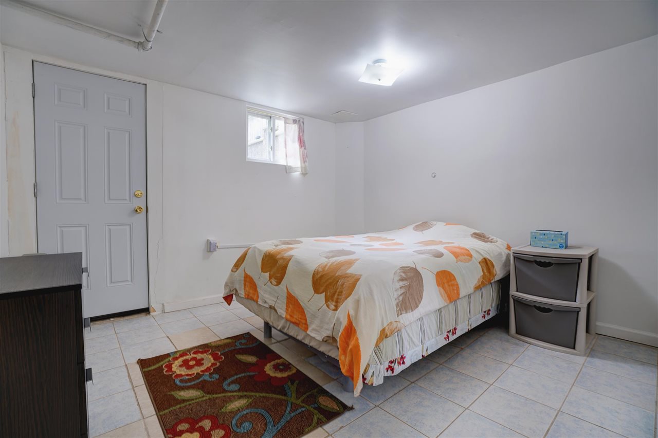 527 North 3rd Street East Newark, NJ 07029 - Photo 18 of 25 a bedroom with a bed and a window