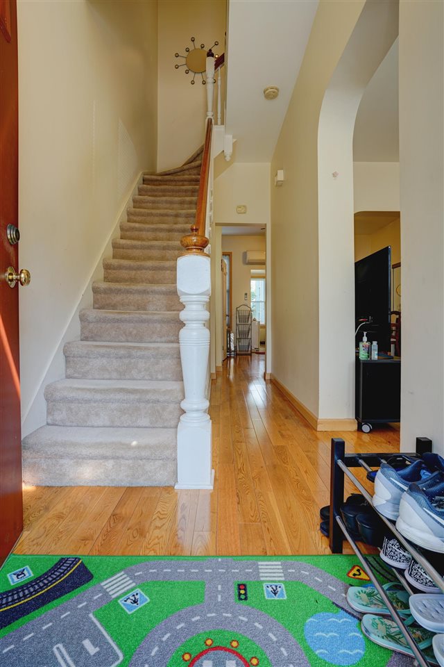 527 North 3rd Street East Newark, NJ 07029 - Photo 3 of 25 a view of livingroom with hardwood floor and entryway