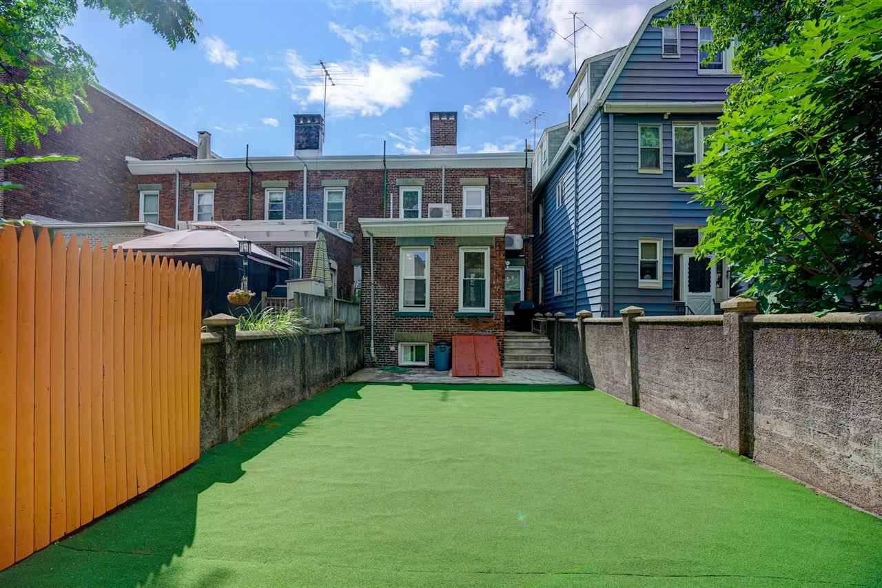 527 North 3rd Street East Newark, NJ 07029 - Photo 23 of 25 a view of a house with a yard and sitting area