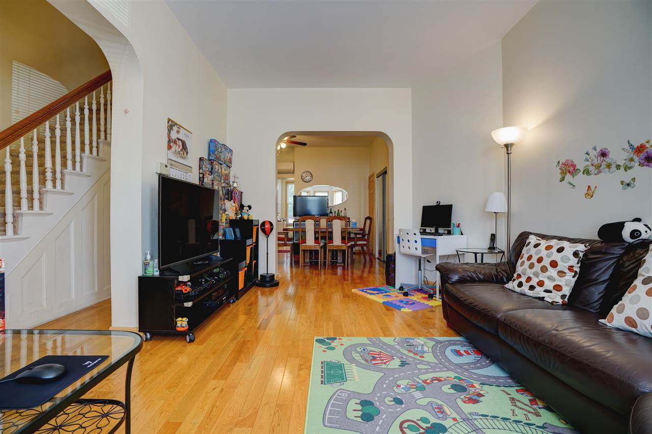 527 North 3rd Street East Newark, NJ 07029 - Photo 6 of 25 a living room with furniture and a flat screen tv